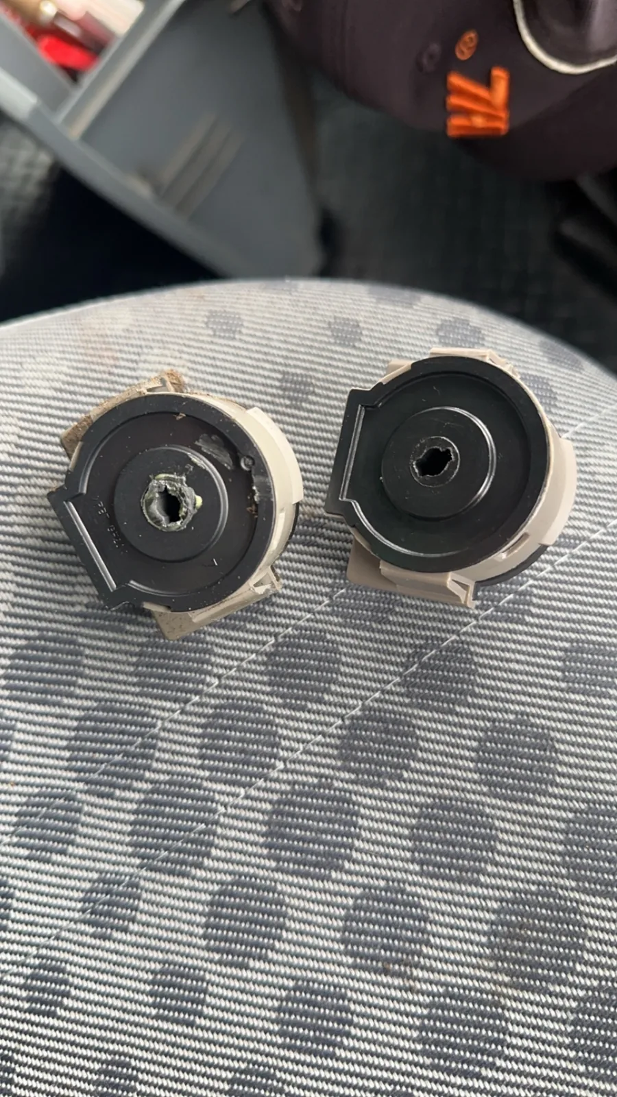 Two ignition lock barrels stripped down for repair by SRM Auto Access