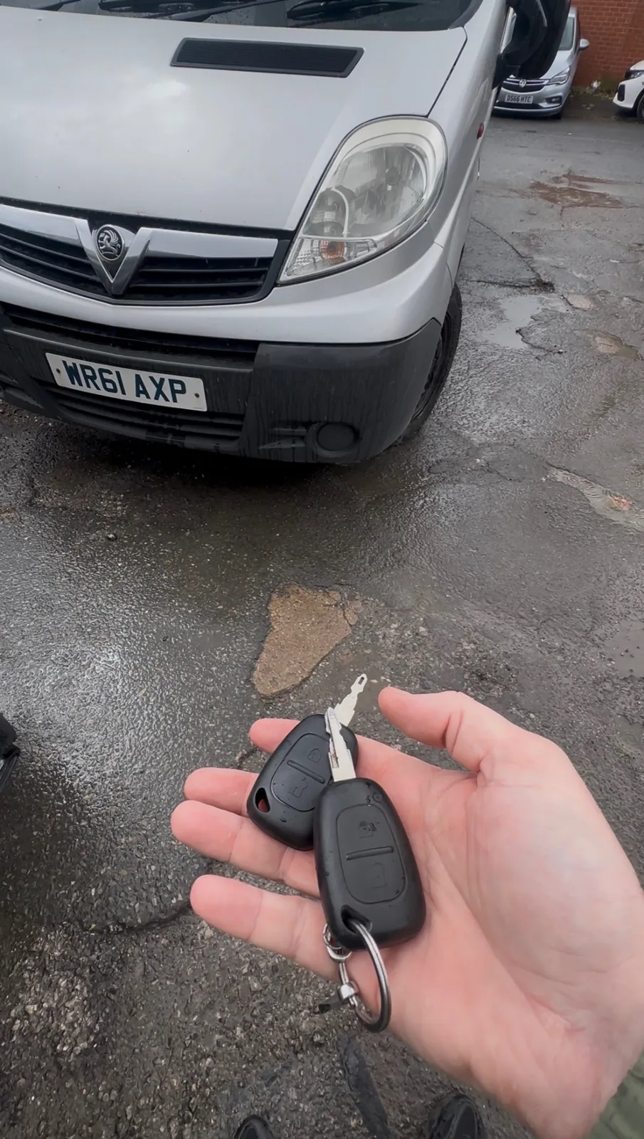 Vauxhall Vivaro van key replacement — new remote in front of a white Vivaro