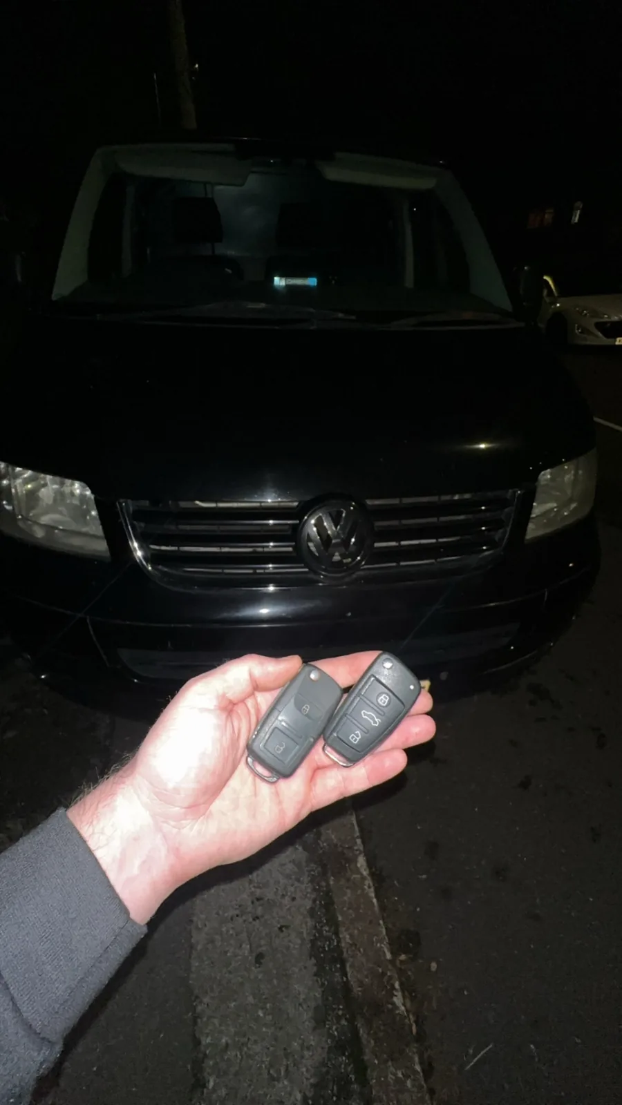 New Volkswagen remote key programmed in front of a black VW in Derby